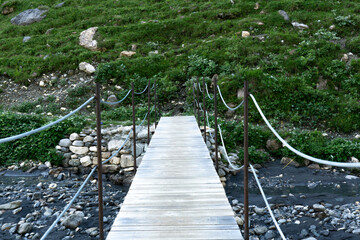 Simple wooden planks as bridge construction in the mountain area