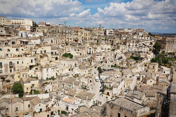 Fototapeta na wymiar Matera, Italy - july 2016: Houses of Matera also called City of stones the European Capital of Culture 2019