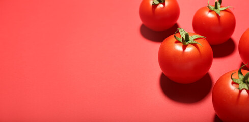Fresh ripe tomatoes on color background with space for text