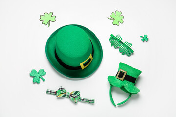 Set of accessories for St. Patrick's Day celebration on white background