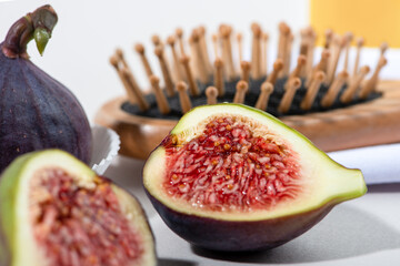 Fresh fig fruits and essential oil close up. Recipe for hair care.