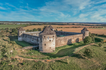 Aerial view of Bzovik, Bozok fortified monastery church in southern Slovakia with four round cannon towers and bridge over the dry moat