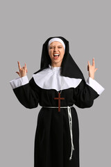 Naughty nun on grey background
