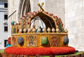 Saint Stephen's ancient Hungarian crown made of flowers as decoration on display in front of the Matthias church in Budapest