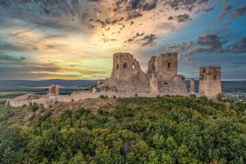 Aerial view of historic Csesznek castle ruin in the Bakony mountain in Hungary with newly restored...