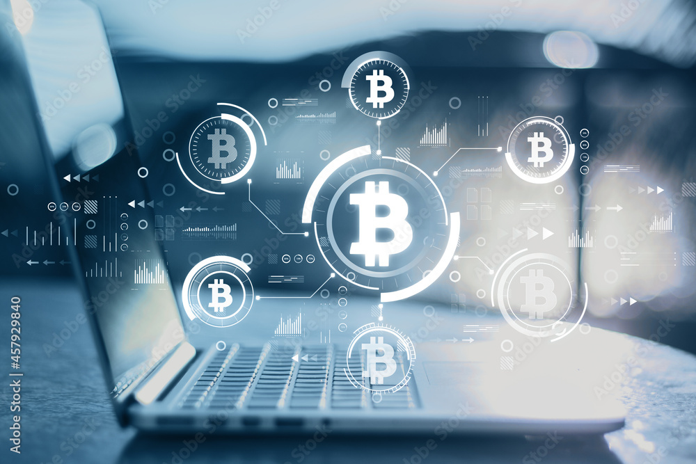 Poster close up of notebook at blurry desktop with creative glowing blue bitcoin interface on dark backgrou