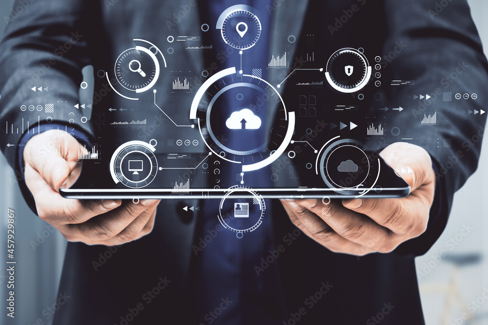 Aufkleber man hands holding tablet with abstract business interface on blurry background. cloud computing, tec