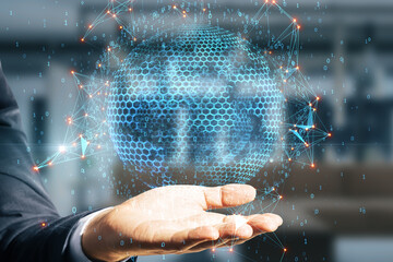 Close up of businessman hand holding abstract globe sphere with coding and polygonal network on blurry office interior background. Future and digital world concept. Double exposure.