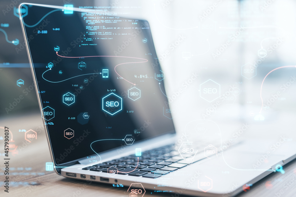 Aufkleber Close up of laptop computer with abstract glowing SEO interface with icons on blurry background. Search engine optimization and coding concept. Double exposure.