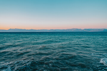 Mediterranean Ionic Sea view, seascape, clear turquoise water surface, ripple, little waves. Universal nature, resort, summer vacation nature background.