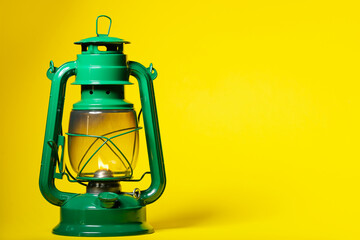 Stylish retro lamp on color background