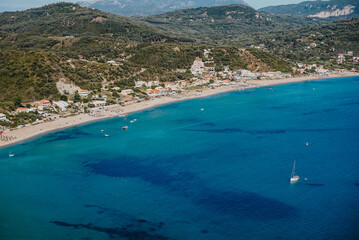 Obraz premium View to seascape with clear azure crystal water. Amazing blue Mediterranean background, coast. Travel destination, universal nature, resort, summer Greece island vacation. 