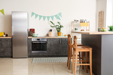 Stylish kitchen interior with dining table