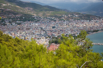 Beach in Alanya, Turkey. View and heights, top view. Blue sea in summer. Vacation in Turkey. Cleopatra beach