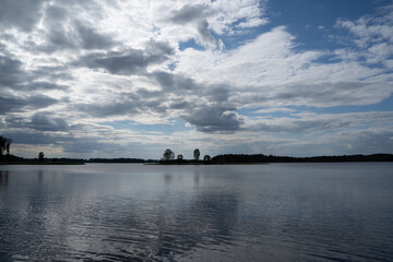 Fototapeta premium Clouds reflection on lake in summer