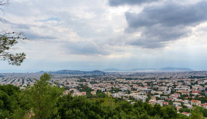 Fototapeta na wymiar Panoramic view of cloudy Athens, taken shot from Penteli mountain.
