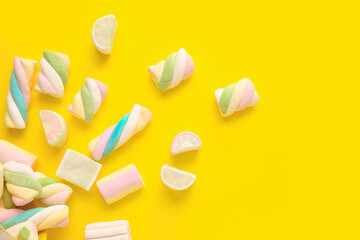 Tasty marshmallows on color background