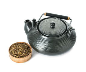Pot and bowl with dry hojicha green tea on white background