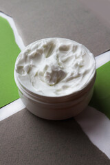 Close-up of open jars of face creams