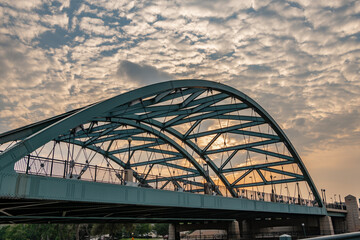 In Denver, Colorado, The famous Colfax Avenue bridge at Confluence Park, connecting the Highland and Lower Downtown (LoDo) neighborhoods. - obrazy, fototapety, plakaty