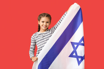 Little girl with the flag of Israel on color background