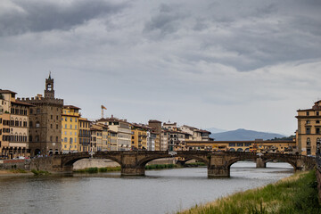 Obraz premium Landscape view of the Ponte Vecchio from a downstream bridge over the Arno river