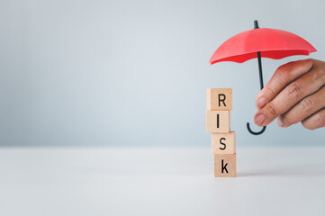Hand hold umbrella protection wooden block with the word 