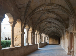 Fototapeta na wymiar Architecture of cloister in courtyard of Monastery of Santa Maria de Vallbona, Urgell, Catalonia, Spain