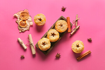 Tasty mince pies on color background
