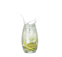 Glass of splashing lemonade on white background