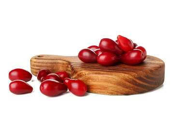 Board with red ripe dogwood berries on white background