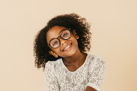Cheerful smiling child black wearing goggles.