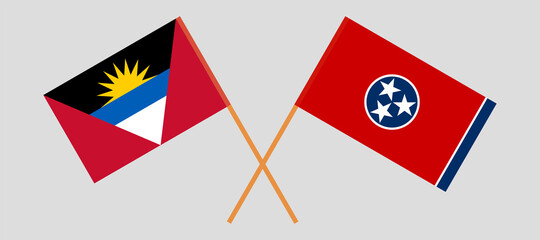 Crossed flags of Antigua and Barbuda and the State of Tennessee. Official colors. Correct proportion