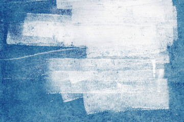 White paint pattern strokes for text and design artwork on old concrete wall texture, blue background