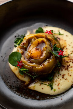 One gourmet chicken dumpling, posh restaurant menu