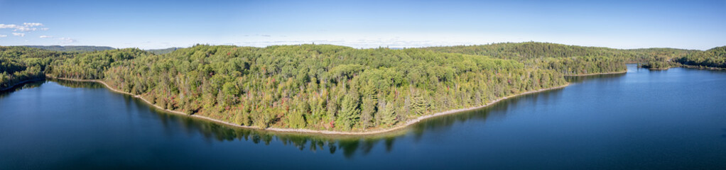 Panorama of a lake during early autumn in northern Ontario Canada.
