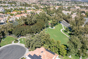 Aerial view of a grassy park in an upscale master planned community