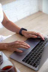 Portrait of a happy young african woman relaxing in outdoor cafe