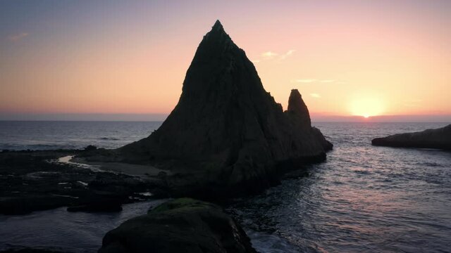 Aerial: Shark Fin rock at sunset on Martin's Beach, California, USA