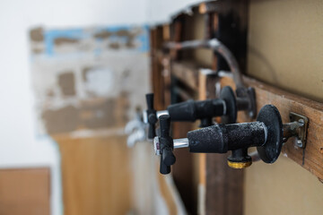 laundry room renovation with plaser walls interior exposed with taps and copper pipes, home renovations and tradesman work