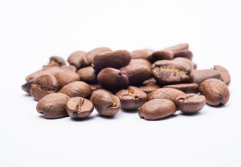 Bean coffee in white background. Medium roasted coffee beans are light brown in color in white background.