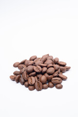 Bean coffee in white background. Medium roasted coffee beans are light brown in color in white background.