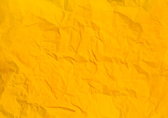 Crumpled yellow paper abstract background texture