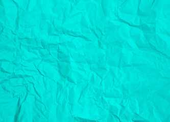 Crumpled turquoise blue paper abstract background texture