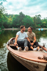 gay couple looking at each other in a boat