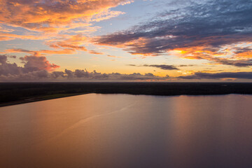 Naklejka na ściany i meble sunset over an alabama lake 