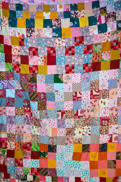 Handmade Patchwork quilt as background.