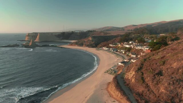 Aerial: The small beach front town of Martin's Beach. Situated near half moon Bay, California, USA