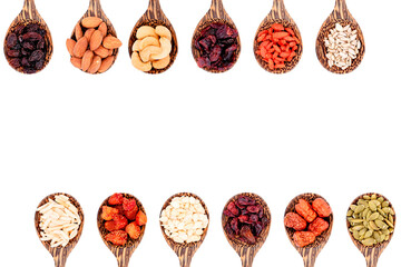 Top view group of whole grains and dried fruits 12 kinds on wooden spoons with copy space isolated on white background.