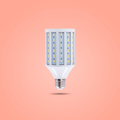 LED energy saving lamp 230v isolated on orange pastel color background